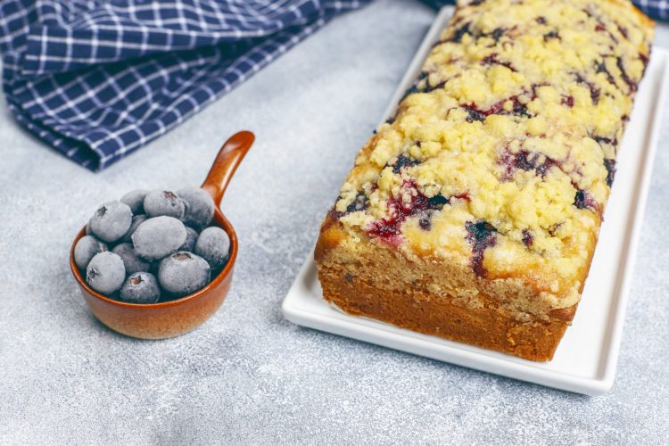 Homemade delicious blueberry crumble cake with frozen blueberrie